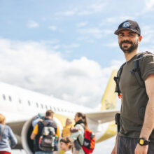 smiling-tourist-prepared-for-a-flight-S5EBYE3.jpg