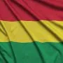 Bolivia flag  is depicted on a sports cloth fabric with many folds. Sport team waving banner